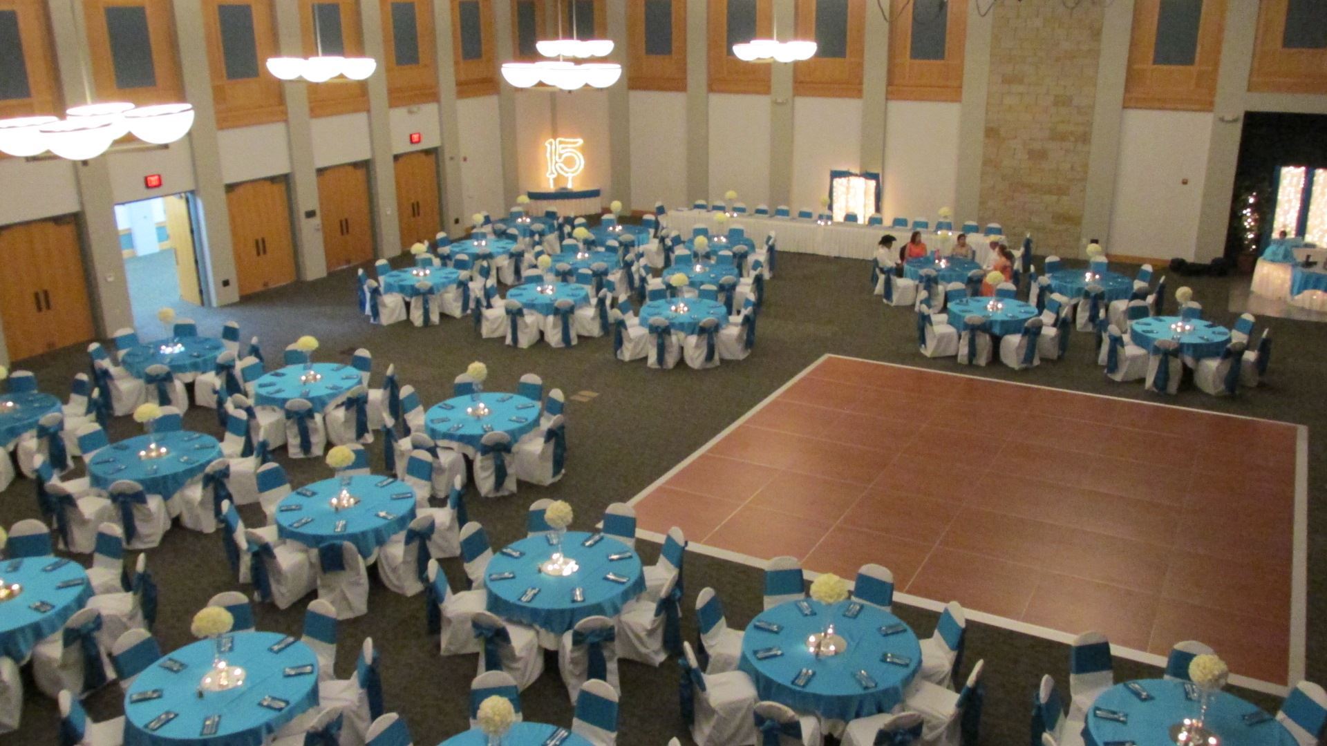 Turquoise and white wedding reception aerial view of tables around the dance floor
